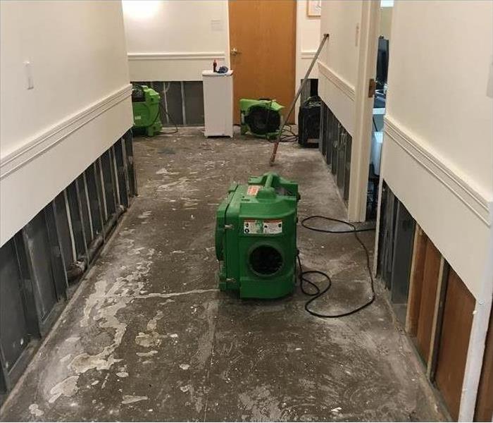 stripped hallway with drying equipment