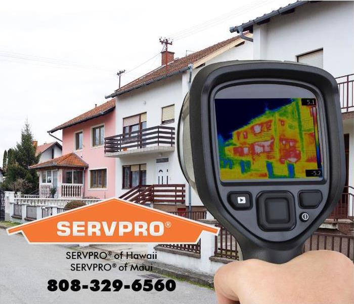 An infrared camera is being pointed at a home. 